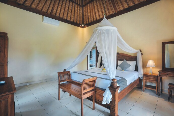 Imagen de la habitación del Hotel The Alus Cottages. Foto 8