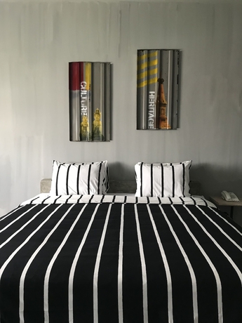 Imagen de la habitación del Hotel The Amartya. Foto 11