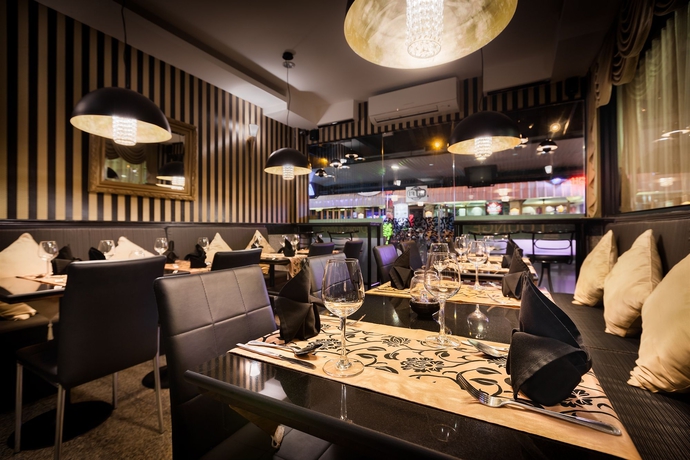 Imagen del bar/restaurante del Hotel The Ambiance. Foto 3