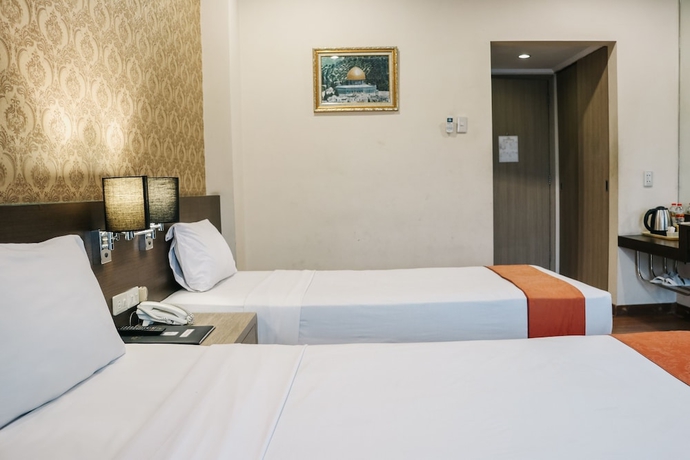 Imagen de la habitación del Hotel The Amrani Syariah. Foto 5