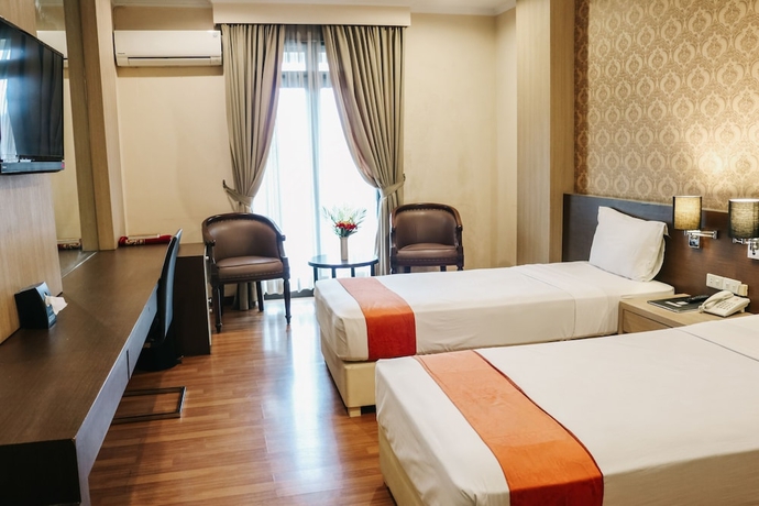 Imagen de la habitación del Hotel The Amrani Syariah. Foto 6