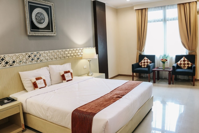Imagen de la habitación del Hotel The Amrani Syariah. Foto 10