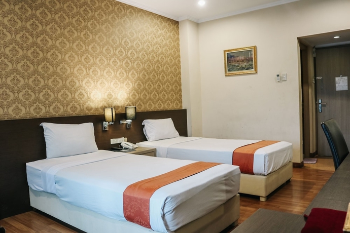Imagen de la habitación del Hotel The Amrani Syariah. Foto 11