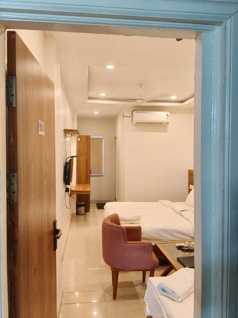 Imagen de la habitación del Hotel The Amrit. Foto 10