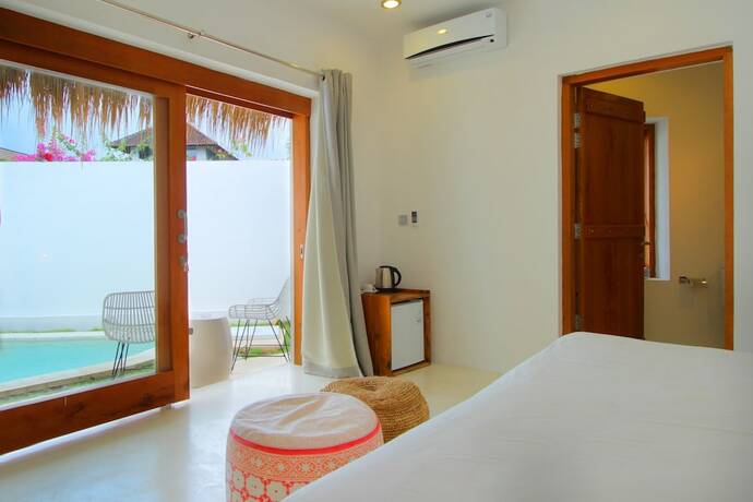 Imagen de la habitación del Hotel The Apartments Canggu. Foto 14