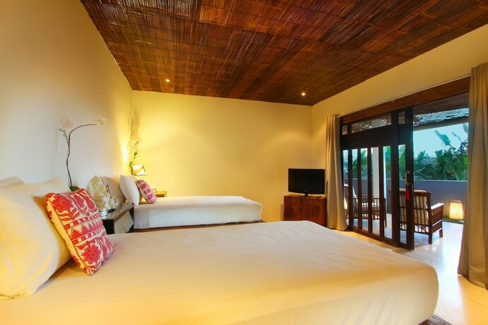 Imagen de la habitación del Hotel The Apartments Canggu. Foto 15