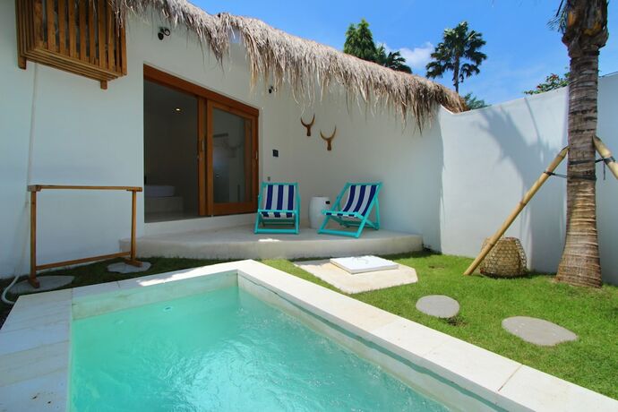 Imagen de la habitación del Hotel The Apartments Canggu. Foto 20