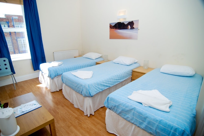 Imagen de la habitación del Hotel The Aqua. Foto 9