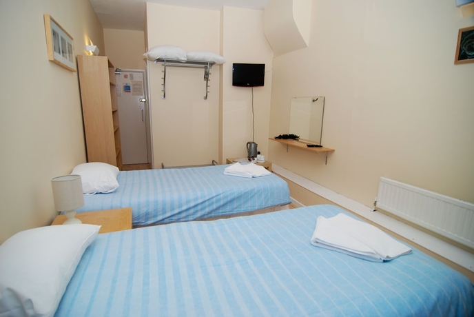 Imagen de la habitación del Hotel The Aqua. Foto 15