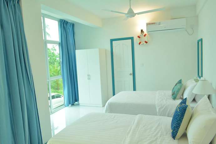 Imagen de la habitación del Hotel The Aquzz. Foto 5