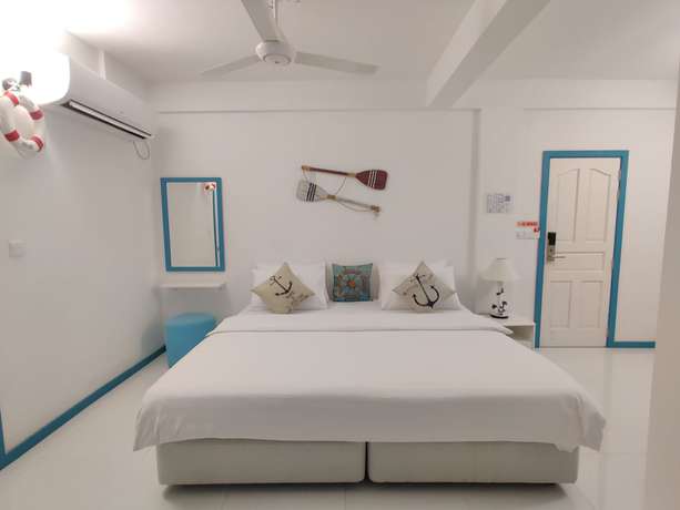 Imagen de la habitación del Hotel The Aquzz. Foto 6