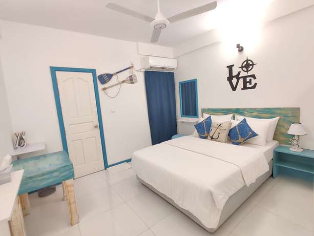 Imagen de la habitación del Hotel The Aquzz. Foto 8
