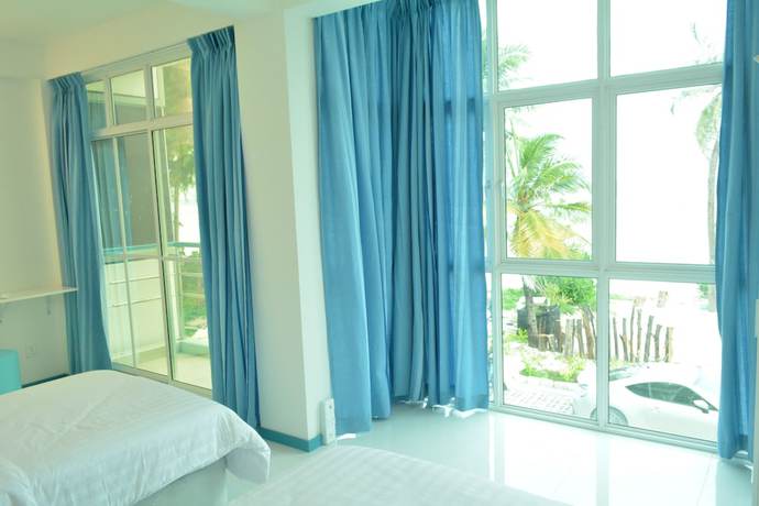 Imagen de la habitación del Hotel The Aquzz. Foto 10