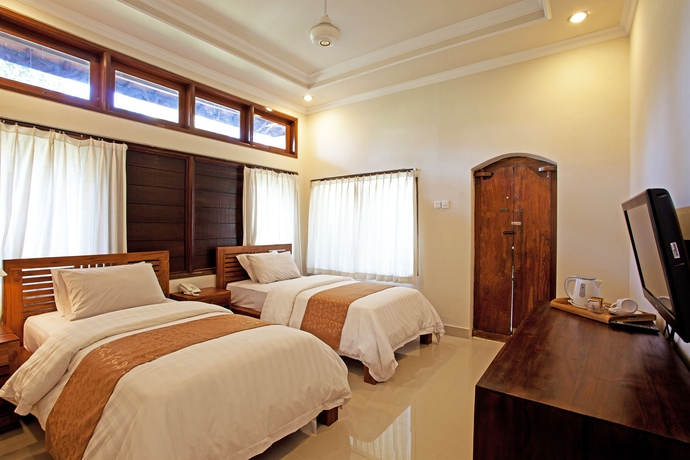 Imagen de la habitación del Hotel The Artini Dijiwa Ubud. Foto 5