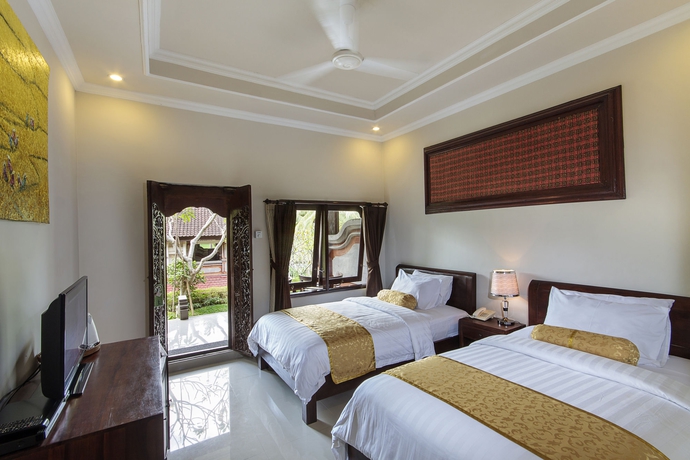 Imagen de la habitación del Hotel The Artini Dijiwa Ubud. Foto 7