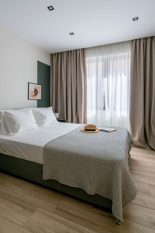 Imagen de la habitación del Hotel The Artisan Suites. Foto 17