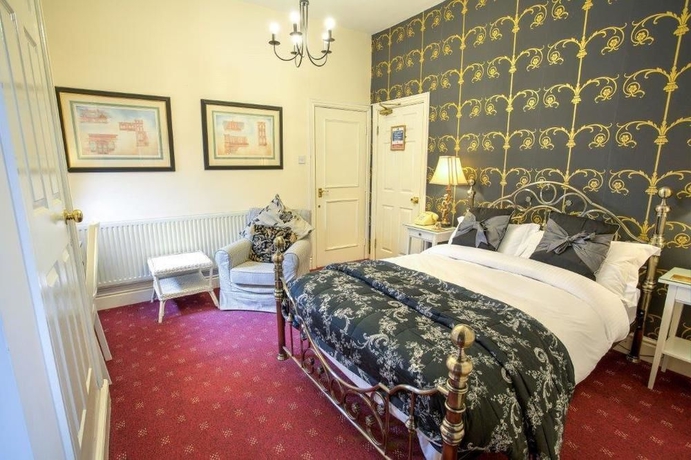 Imagen de la habitación del Hotel The Ascott. Foto 4