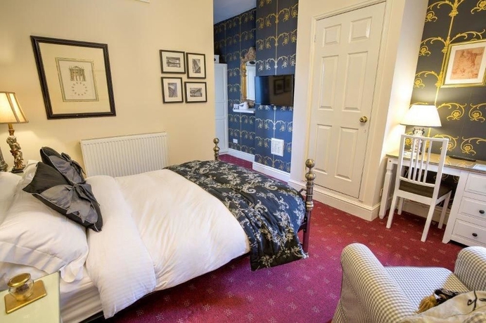 Imagen de la habitación del Hotel The Ascott. Foto 6