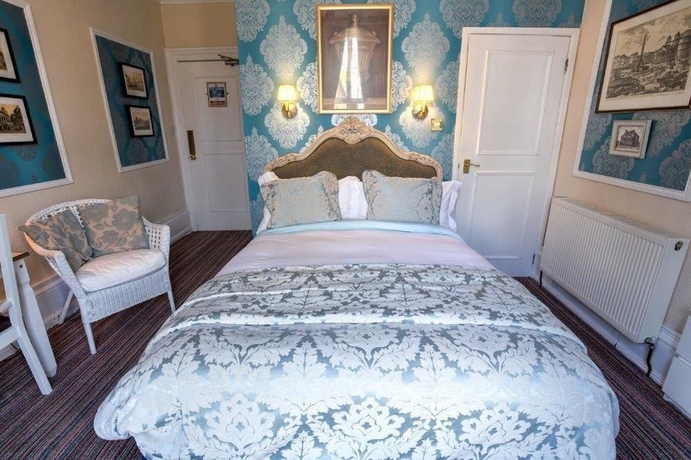 Imagen de la habitación del Hotel The Ascott. Foto 7