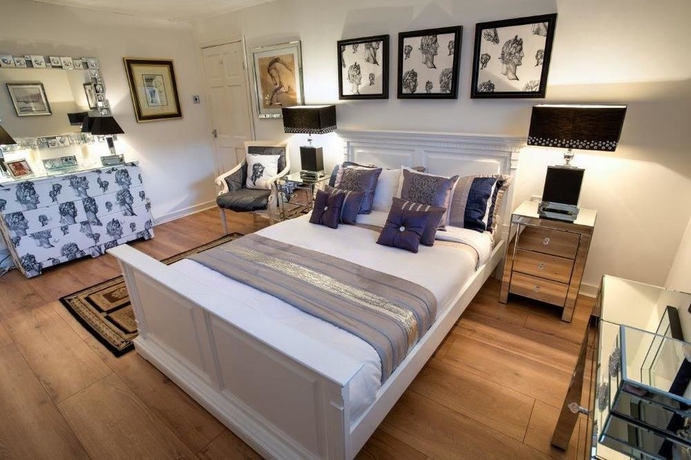 Imagen de la habitación del Hotel The Ascott. Foto 8