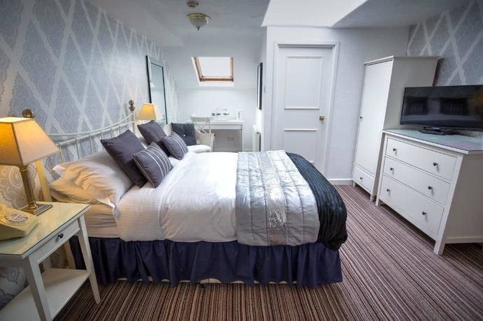 Imagen de la habitación del Hotel The Ascott. Foto 9