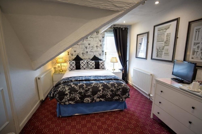 Imagen de la habitación del Hotel The Ascott. Foto 10