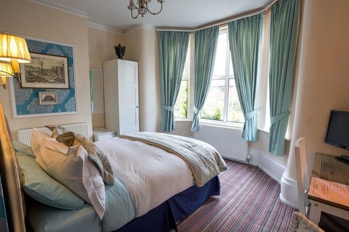 Imagen de la habitación del Hotel The Ascott. Foto 12