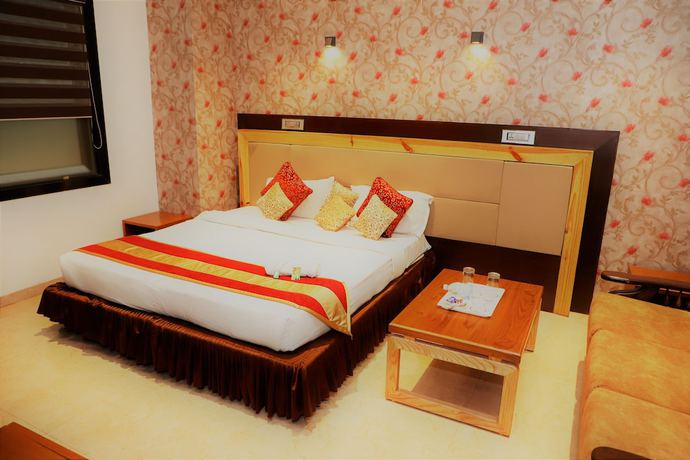 Imagen de la habitación del Hotel The Ashoka. Foto 11