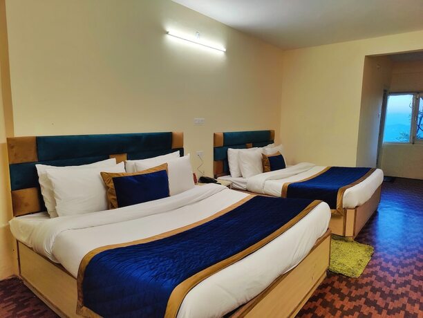 Imagen de la habitación del Hotel The Ashoka Inn. Foto 15