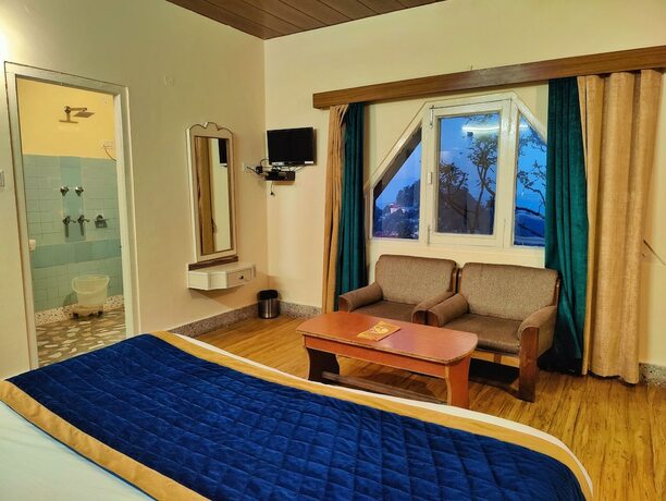 Imagen de la habitación del Hotel The Ashoka Inn. Foto 17