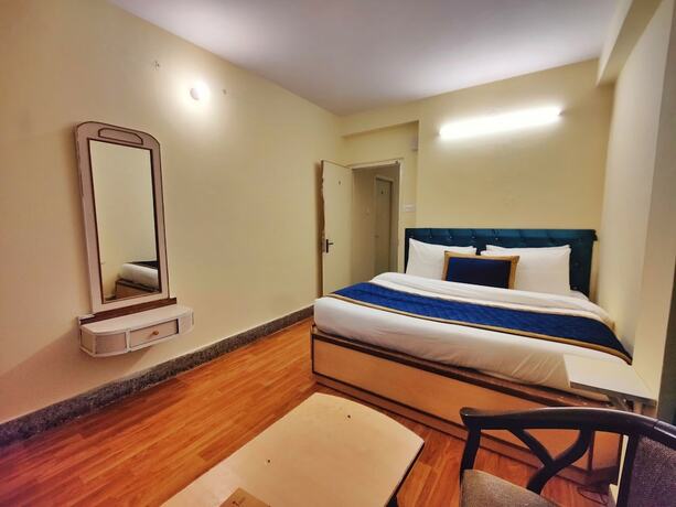 Imagen de la habitación del Hotel The Ashoka Inn. Foto 18
