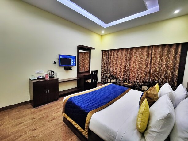 Imagen de la habitación del Hotel The Ashoka Inn. Foto 19