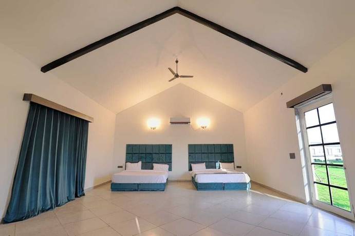 Imagen de la habitación del Hotel The Ashoka farms and Resort. Foto 5