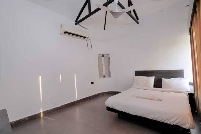 Imagen de la habitación del Hotel The Ashoka farms and Resort. Foto 6