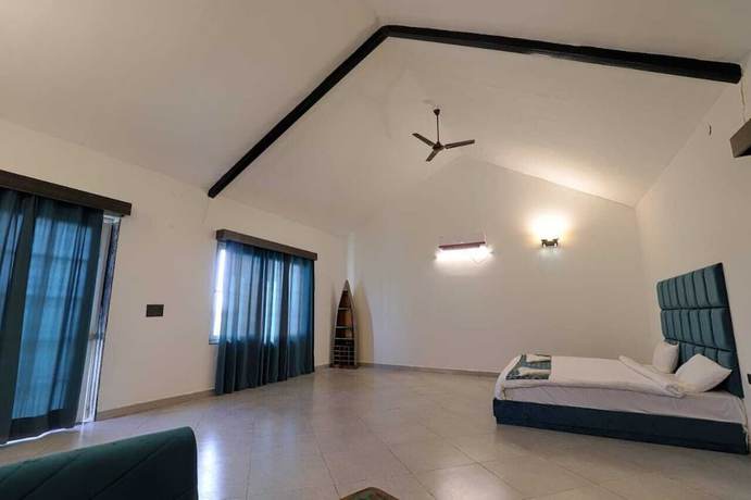 Imagen de la habitación del Hotel The Ashoka farms and Resort. Foto 7