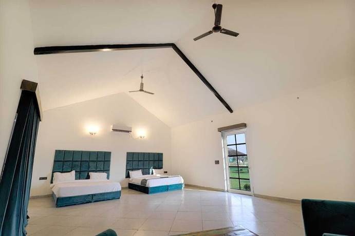 Imagen de la habitación del Hotel The Ashoka farms and Resort. Foto 8