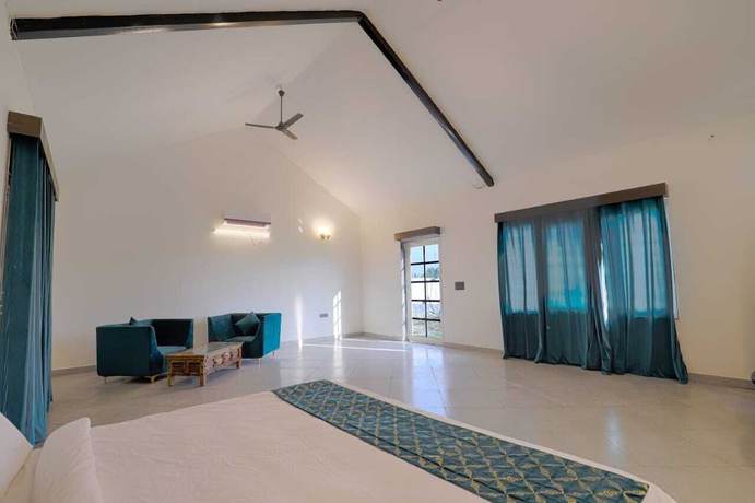 Imagen de la habitación del Hotel The Ashoka farms and Resort. Foto 9