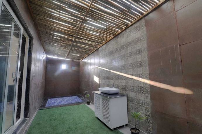 Imagen de la habitación del Hotel The Ashoka farms and Resort. Foto 11