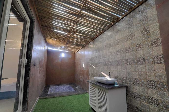 Imagen de la habitación del Hotel The Ashoka farms and Resort. Foto 12
