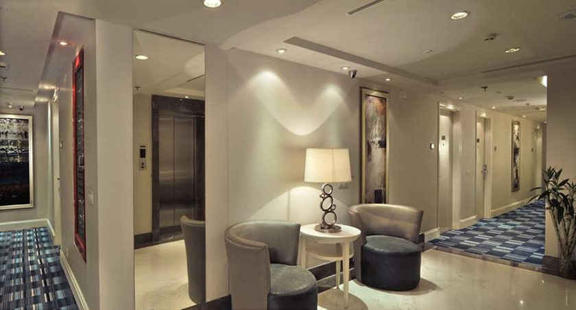 Imagen de la habitación del Hotel The Ashtan Sarovar Portico Delhi. Foto 10