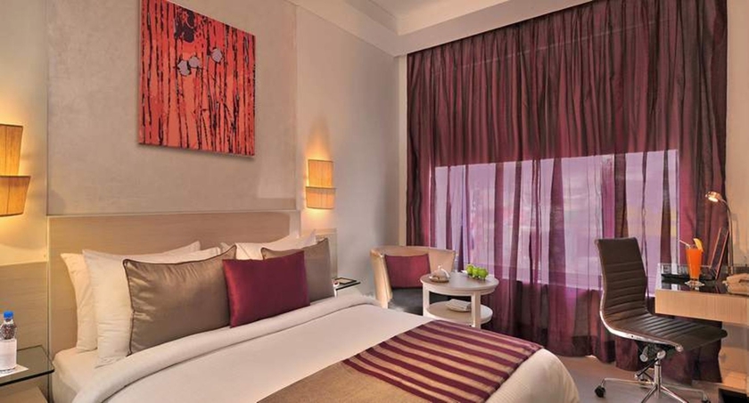 Imagen de la habitación del Hotel The Ashtan Sarovar Portico Delhi. Foto 11