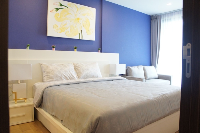 Imagen de la habitación del Hotel The Astra Luxury Suit Condo. Foto 2