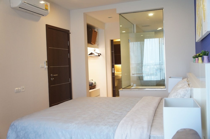 Imagen de la habitación del Hotel The Astra Luxury Suit Condo. Foto 8