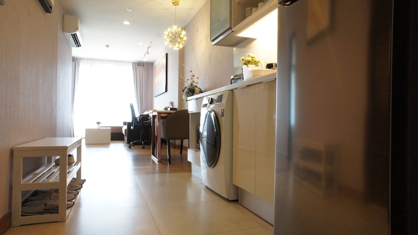 Imagen de la habitación del Hotel The Astra Luxury Suit Condo. Foto 10
