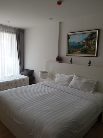 Imagen de la habitación del Hotel The Astra Luxury Suit Condo. Foto 12