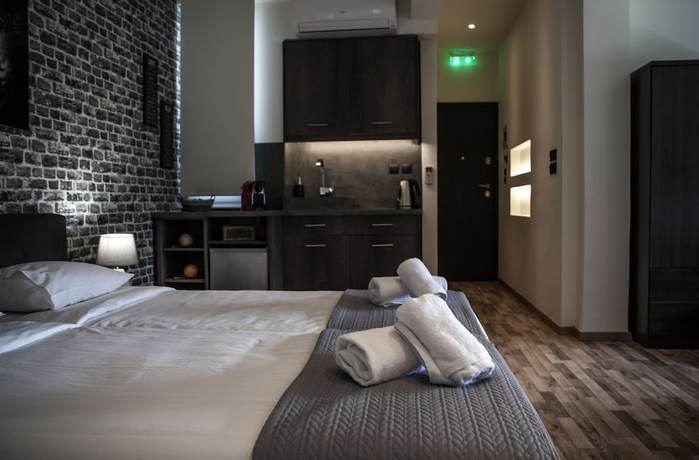 Imagen de la habitación del Hotel The Athens Version Luxury Suites. Foto 4