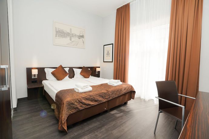 Imagen de la habitación del Hotel The Atrium, Bahnhofsviertel. Foto 2