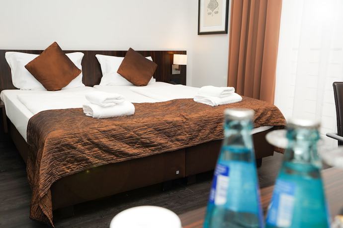 Imagen de la habitación del Hotel The Atrium, Bahnhofsviertel. Foto 3