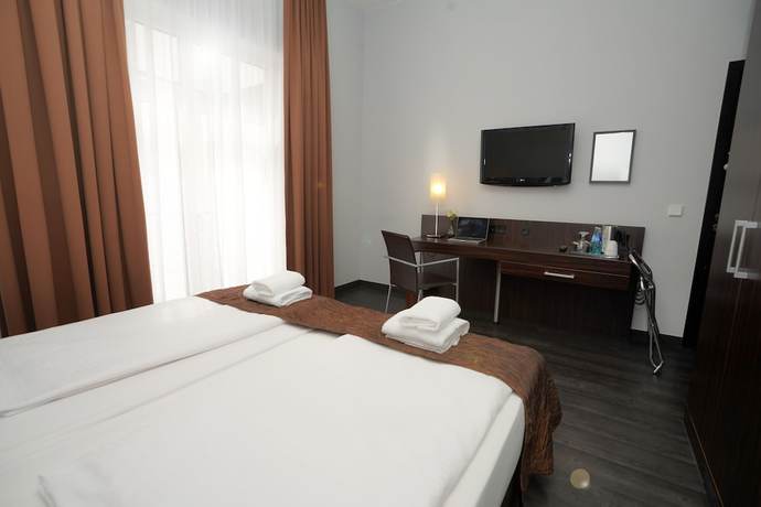 Imagen de la habitación del Hotel The Atrium, Bahnhofsviertel. Foto 8