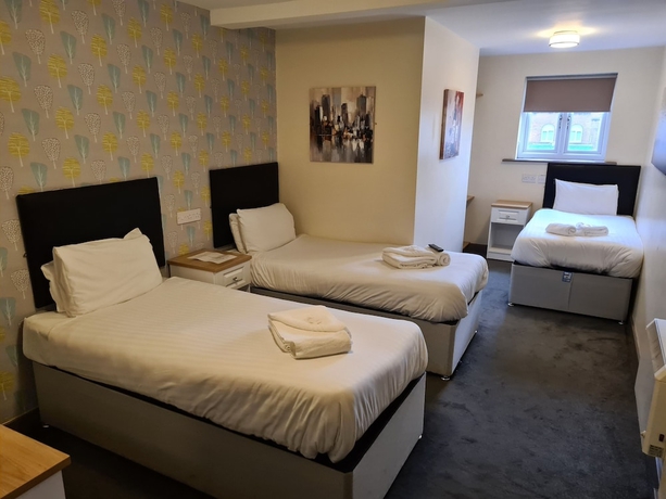 Imagen de la habitación del Hotel The Avenue Lodge. Foto 5